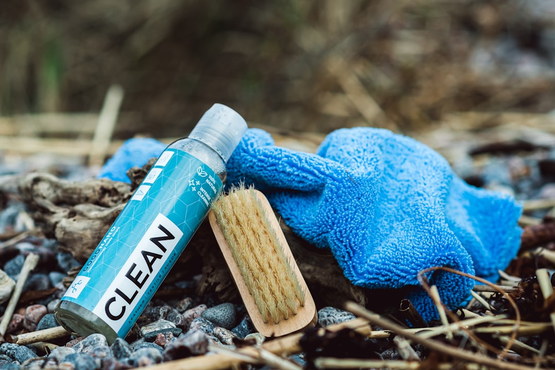 a-close-up-of-a-blue-glove-and-a-tube-of-clean-vjd2z05nkfs